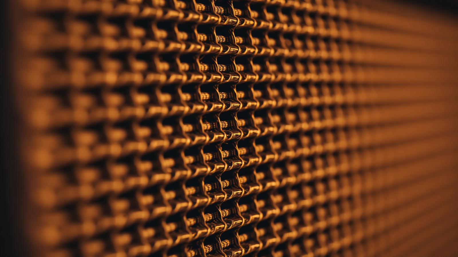 Vintage amplifier grille cloth in warm light